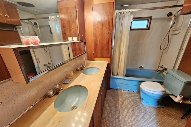 full bathroom featuring tile patterned floors, vanity, shower / tub combo, and toilet