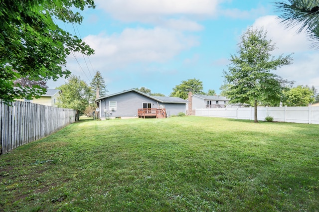 view of yard featuring a wooden deck