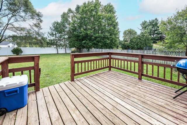 wooden terrace with a yard