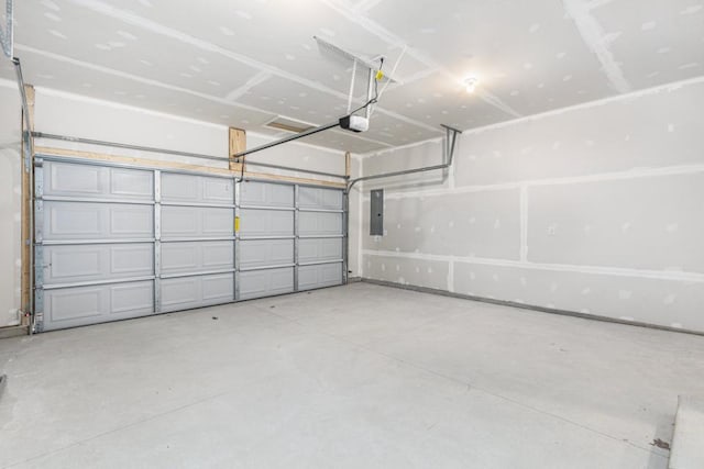 garage featuring electric panel and a garage door opener