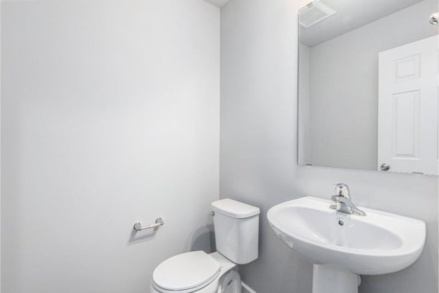 bathroom with toilet and sink