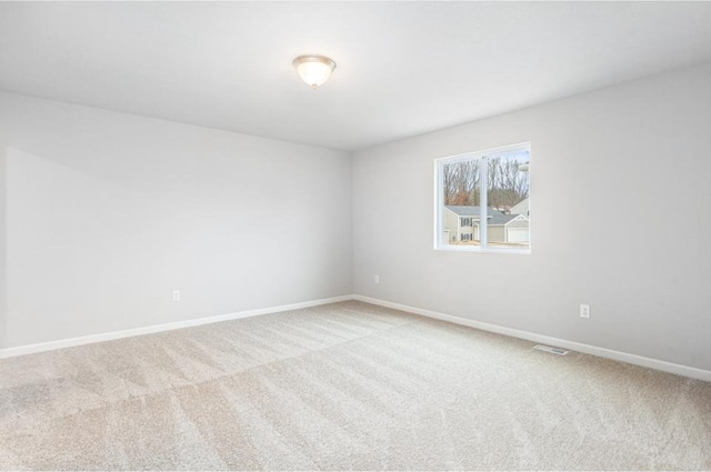 unfurnished room with carpet floors