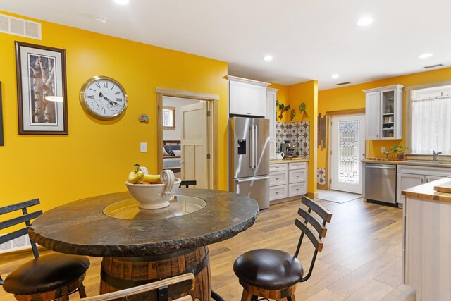 2144 N Jacobson Rd, Suttons Bay, MI 49682 - dining space featuring light wood-style flooring and recessed lighting