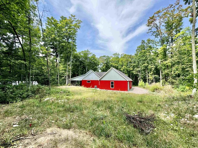 2144 N Jacobson Rd, Suttons Bay, MI 49682 - view of yard featuring a view of trees
