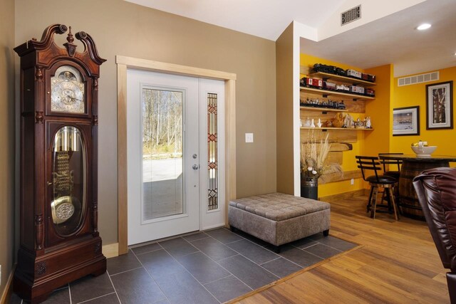 2144 N Jacobson Rd, Suttons Bay, MI 49682 - foyer entrance with recessed lighting, a bar, and baseboards