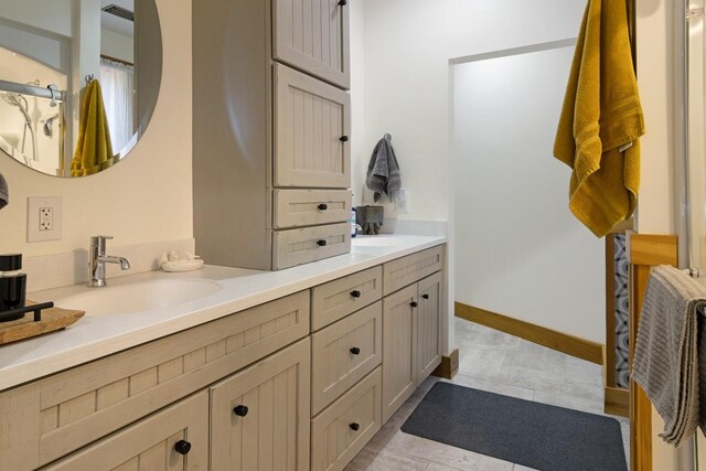 2144 N Jacobson Rd, Suttons Bay, MI 49682 - full bathroom featuring double vanity and tile patterned floors
