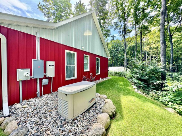 2144 N Jacobson Rd, Suttons Bay, MI 49682 - view of home's exterior featuring a lawn