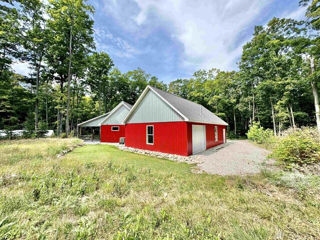 2144 N Jacobson Rd, Suttons Bay, MI 49682 - view of side of property featuring an outbuilding