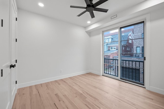 unfurnished room with light wood-type flooring and ceiling fan