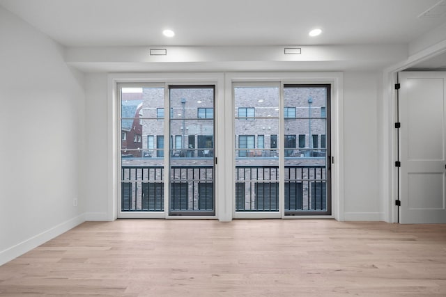 unfurnished room featuring light hardwood / wood-style flooring