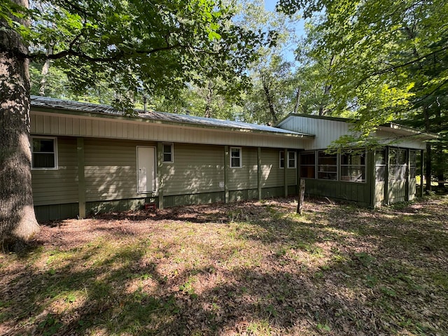 rear view of house with a sunroom