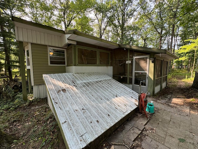 exterior space featuring a sunroom