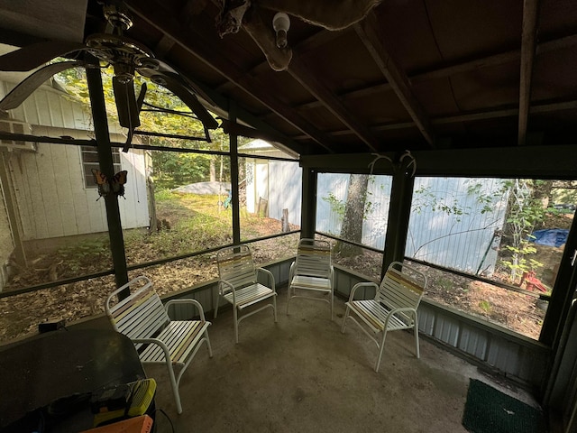 unfurnished sunroom with lofted ceiling