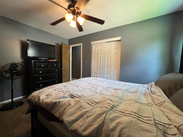 bedroom featuring ceiling fan, a closet, and carpet