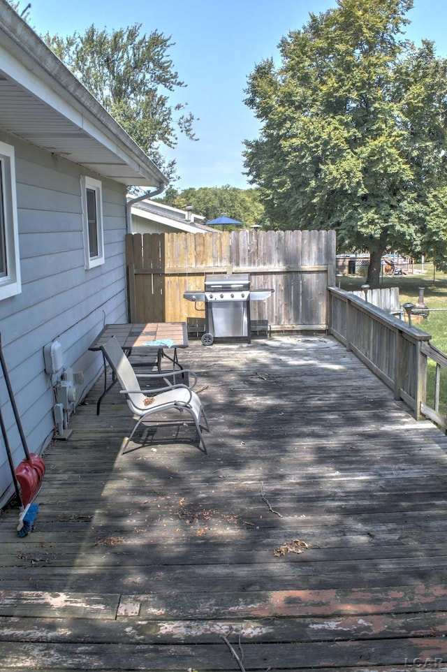 wooden deck featuring area for grilling