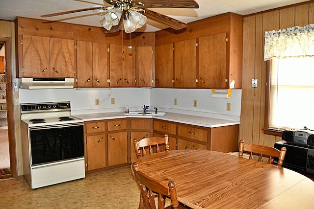 kitchen featuring white range with electric cooktop, ceiling fan, sink, and range hood