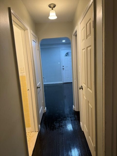 hallway with dark wood-type flooring