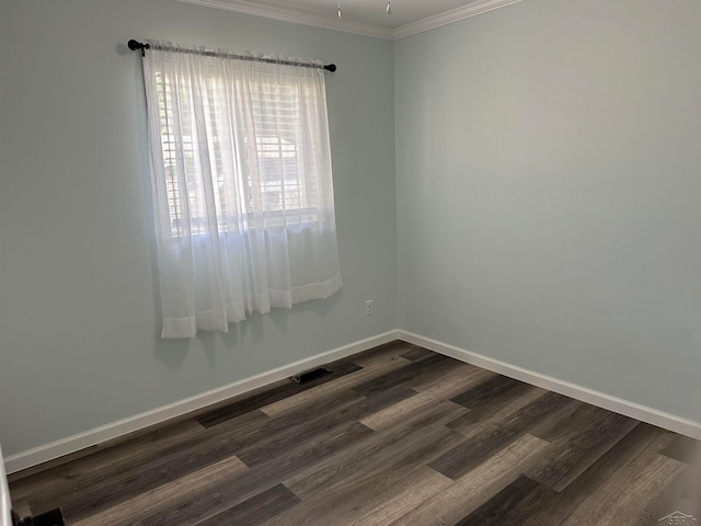 unfurnished room featuring crown molding and dark wood-type flooring