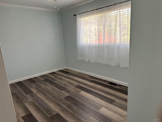 spare room with dark hardwood / wood-style floors, ceiling fan, and crown molding