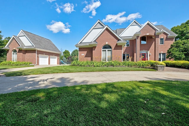 view of front property featuring a garage and a front lawn