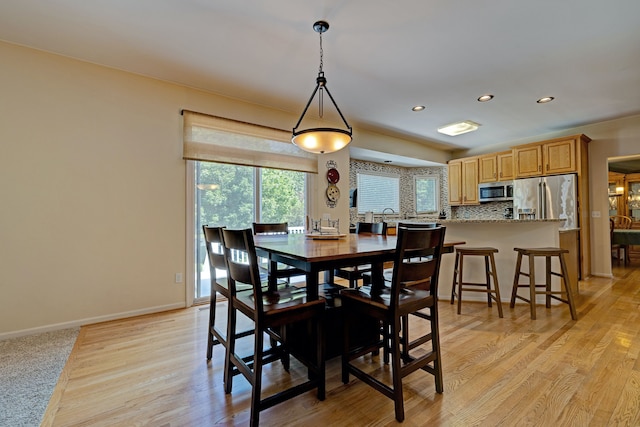 dining area with light hardwood / wood-style flooring