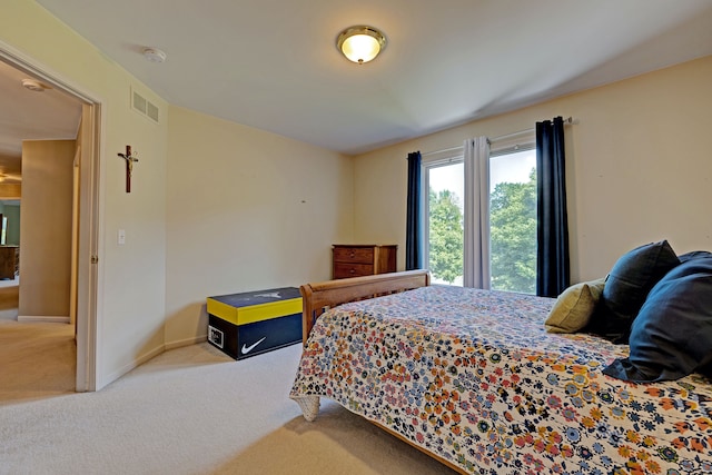 bedroom with light colored carpet