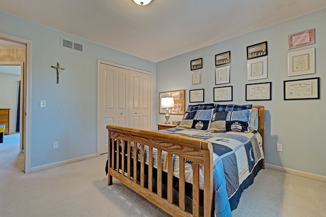 carpeted bedroom featuring a closet