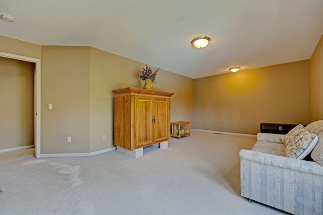 sitting room featuring light carpet