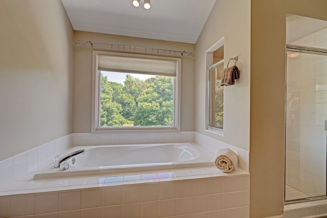 bathroom with a wealth of natural light and plus walk in shower