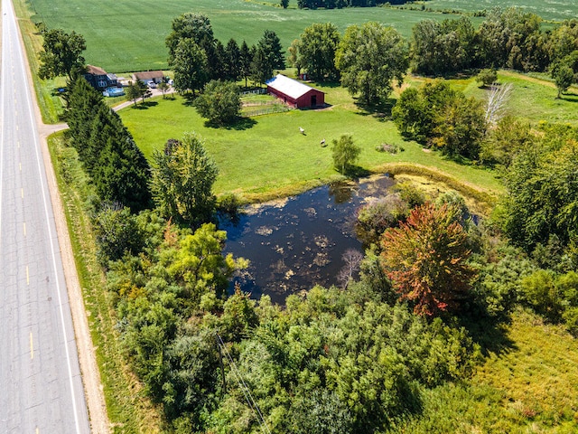 drone / aerial view featuring a rural view and a water view