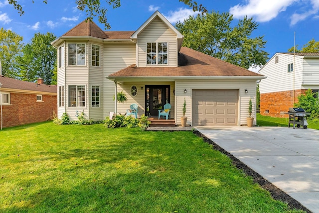 view of front of property with a garage and a front yard