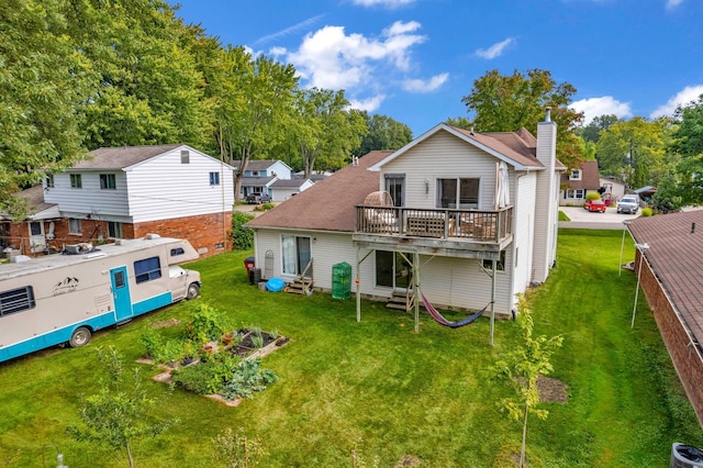 rear view of property with a lawn