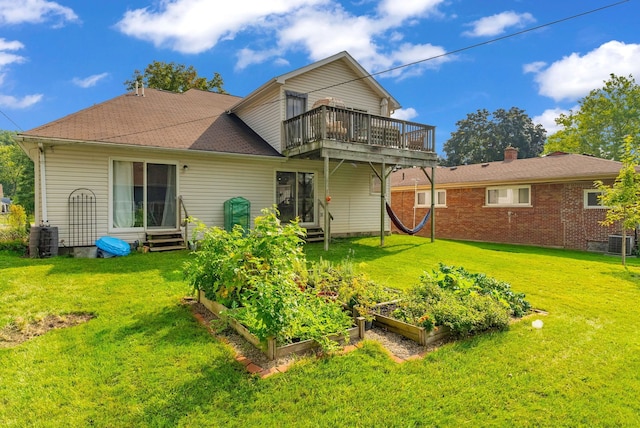 back of house with a yard and central AC unit