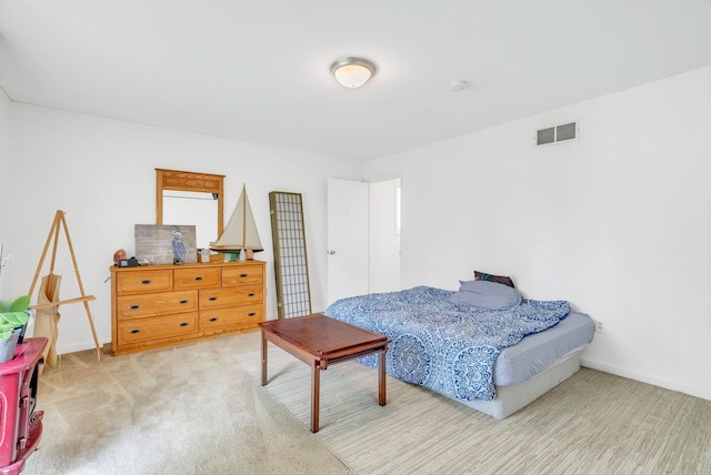 bedroom featuring light carpet