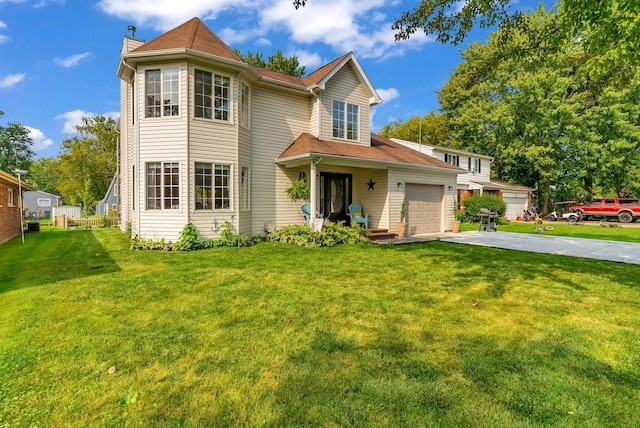 view of front facade featuring a garage and a front lawn