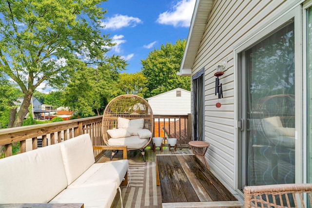 wooden deck featuring an outdoor hangout area