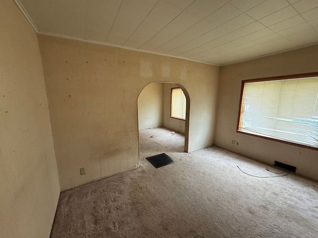 carpeted empty room with ornamental molding