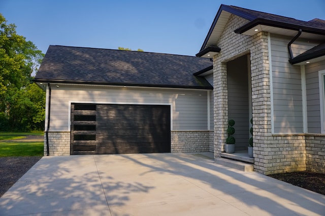 view of side of property featuring a garage