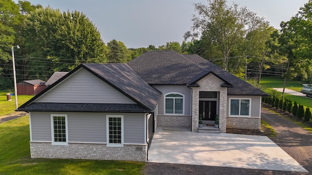 back of property featuring a yard and a patio area