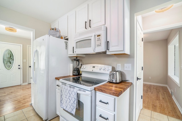 kitchen featuring light hardwood / wood-style floors, white appliances, white cabinetry, and wooden counters