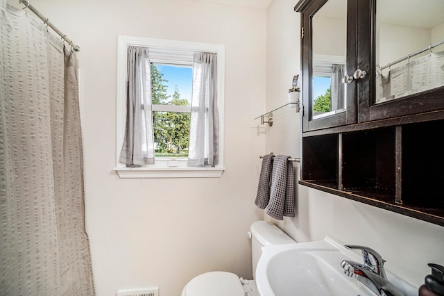 bathroom with sink and toilet