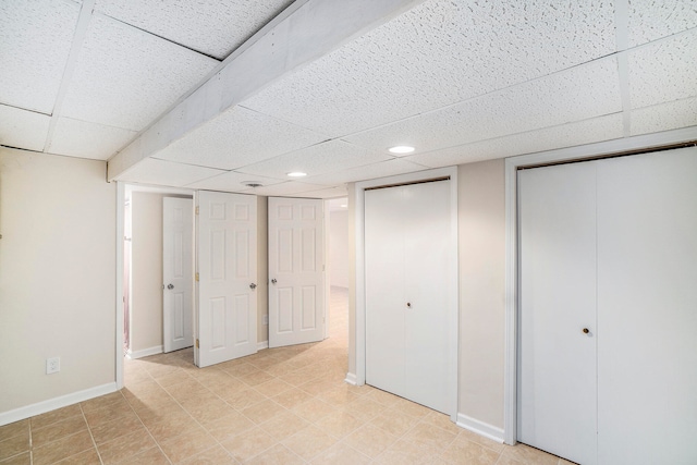 basement featuring a drop ceiling