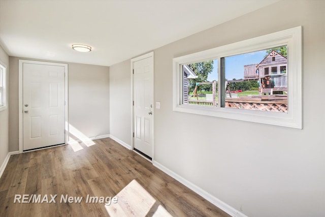 entrance foyer with hardwood / wood-style floors