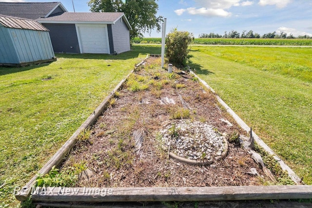 view of yard featuring a rural view and a storage shed