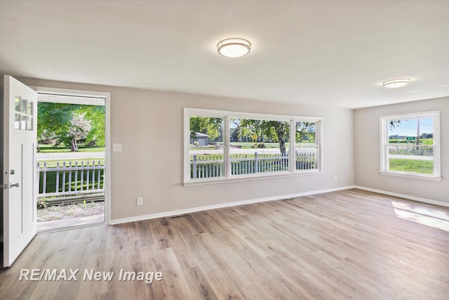 spare room featuring light hardwood / wood-style flooring