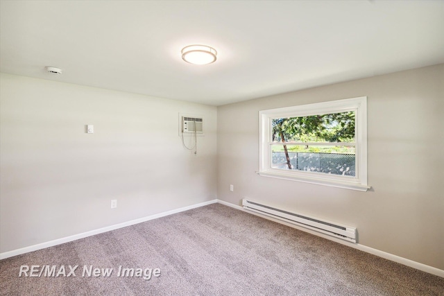 carpeted spare room featuring a wall unit AC and a baseboard radiator