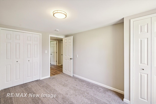 unfurnished bedroom with carpet floors