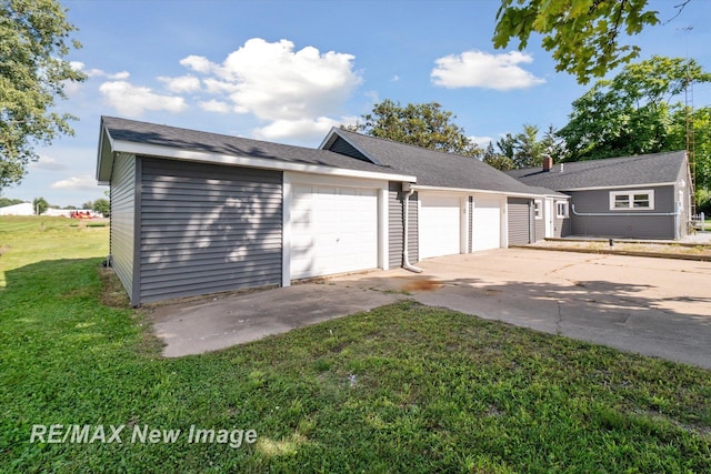 garage with a lawn