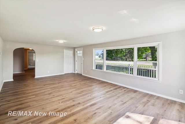 unfurnished room featuring light wood-type flooring