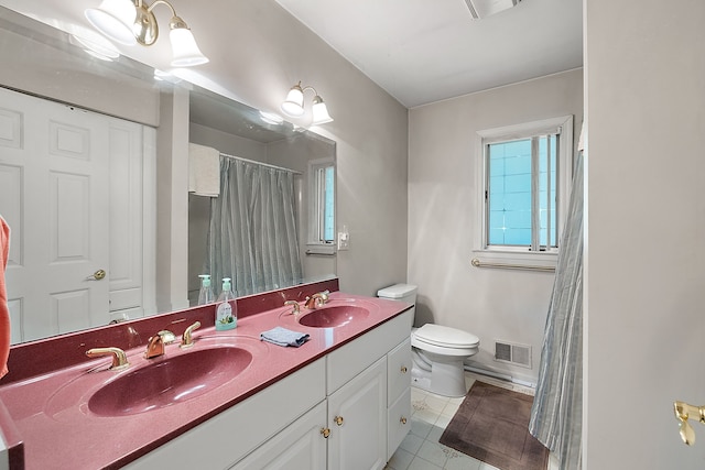 bathroom with walk in shower, tile patterned flooring, vanity, and toilet